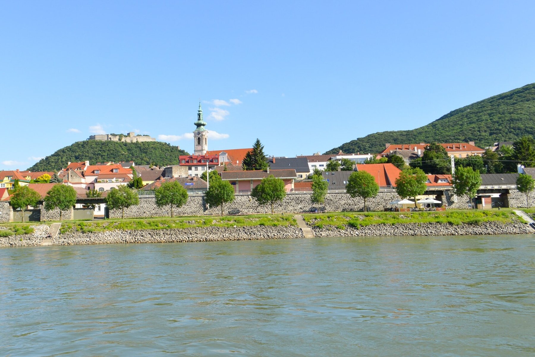 Hainburg an der Donau seen from the Danube, with the castle ruin on the hill